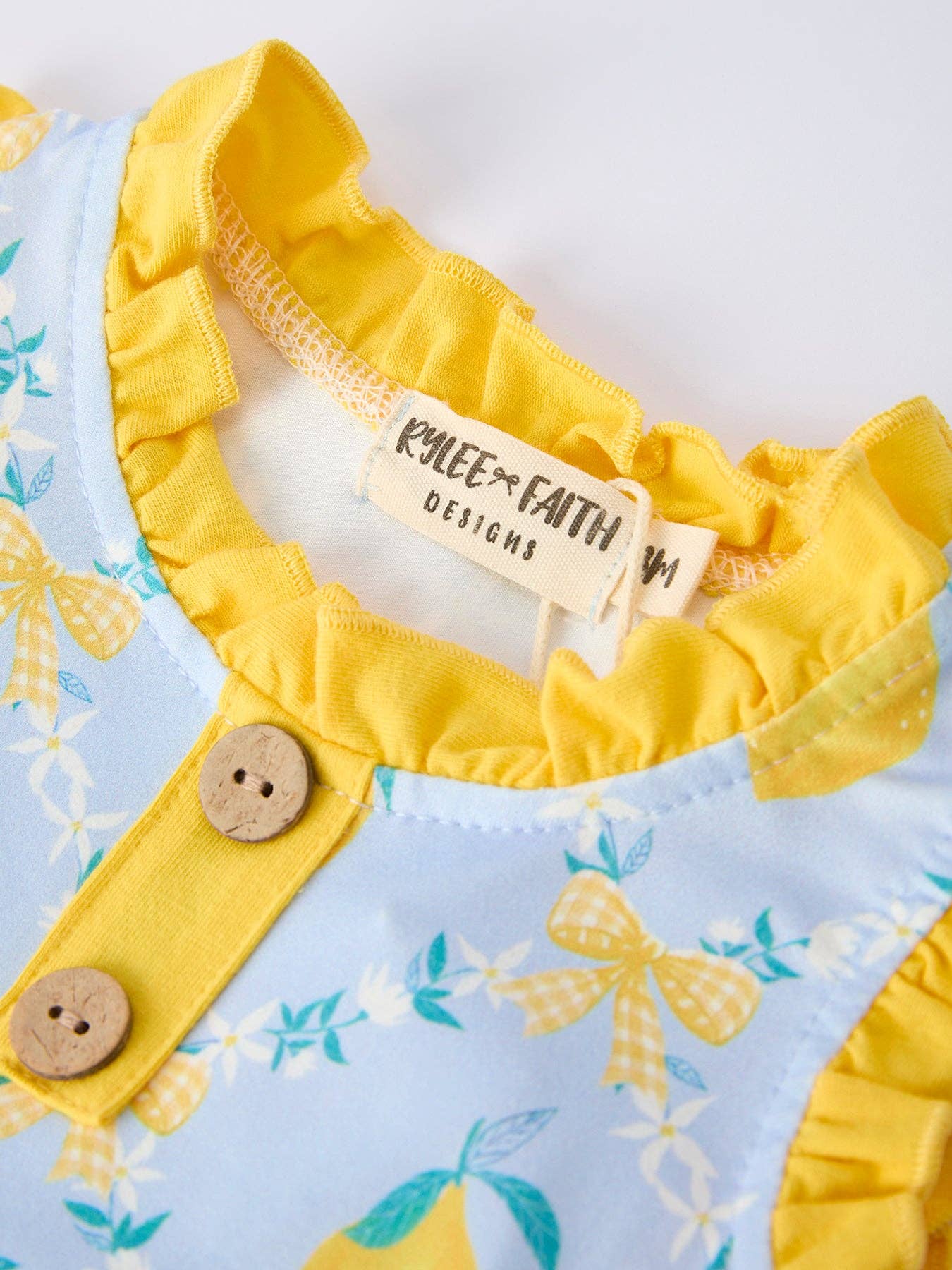 Lemon Floral Print Girl Sleeveless Ruffle Romper